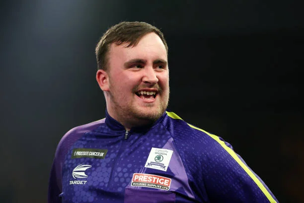 Luke Littler of England reacts during the 2023/24 Paddy Power World Darts Championship Final between Luke Littler of England and Luke Humphries of...