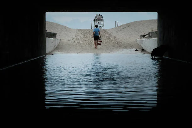 Teenager walks to Gilgo Beach on July 18, 2023 in Babylon, New York. Rex Heuermann, a 59-year-old New York architect, has been charged with murdering...
