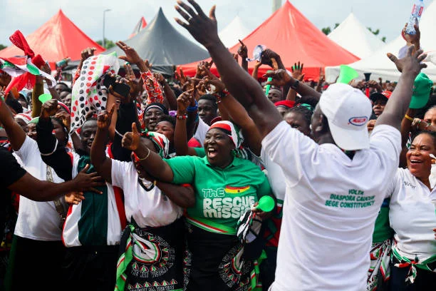 Supporters of former Ghana president and presidential candidate for the National Democratic Congress John Dramani Mahama gather during the party's...