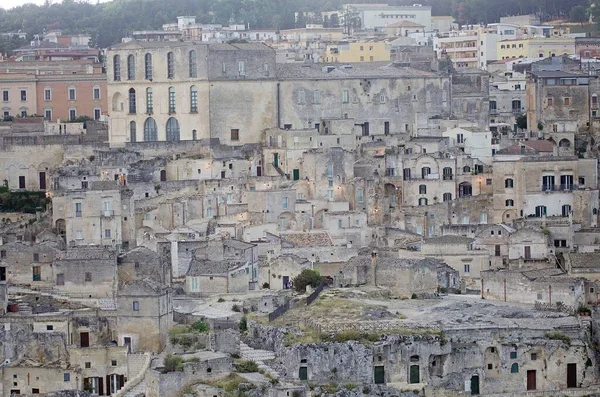 The Sassi of Matera in Matera, Italy. The Sassi of Matera are two district, Sasso Caveoso and Sasso Barisano, of the italian city of Matera, Basilicata, known for their ancient cave dwellings inhabited since the Paleolithic period.  - Photo, Image