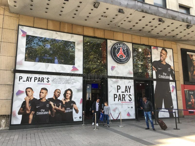 Paris France, 23 September 2017: PSG Paris Saint Germain football team official store on Les Champs Elysees with pictures of Neymar Mbappe and Cavani on window display. Psg stock images, royalty-free photos and pictures