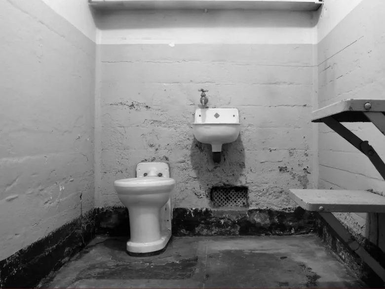 A stock image shoes a prison bathroom with stark