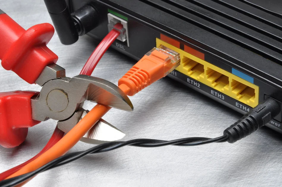 Pliers cutting ethernet cord