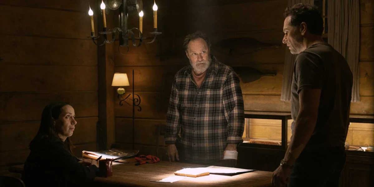Matthew Rhys as Tom, Stephen Root as Wyck, and Kate O'Flynn as Patricia around a table in Widow's Bay