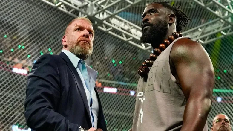 Paul "Triple H" Levesque shakes hands with Oba Femi before the weigh-in segment on the July 27, 2026 edition of "WWE Raw."