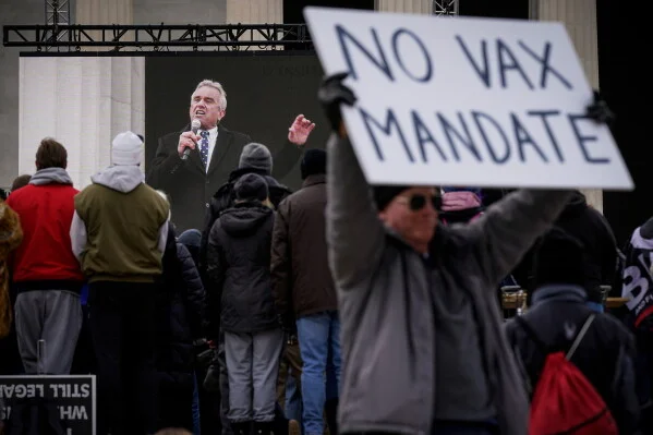 Robert F. Kennedy Jr. is broadcast on a large screen as he speaks during an anti-vaccine rally in front of the Lincoln Memorial in Washington, Sunday, Jan. 23, 2022. (AP Photo/Patrick Semansky, File)