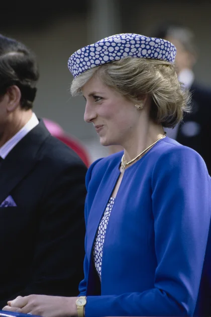 Princess Diana wears a blue dress with butterfly earrings for a visit to Canada in 1986