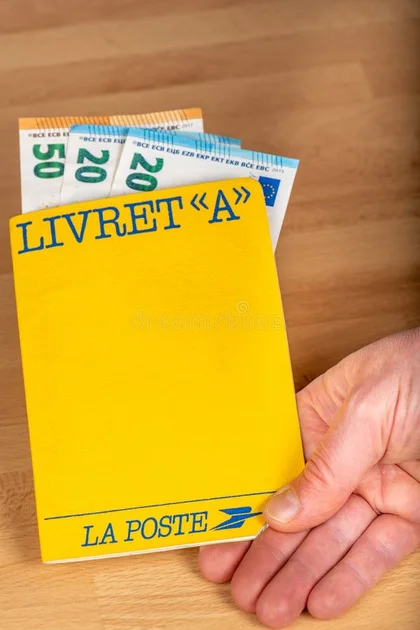 Livret A, `Laposte` postal savings book in the hand of a person stock image