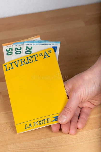 Livret A, `Laposte` postal savings book in the hand of a person stock photography