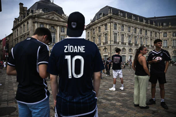 Supporters of the Girondins de Bordeaux football club rally to support the club outside the Commercial Court in Bordeaux, southwestern France, on...