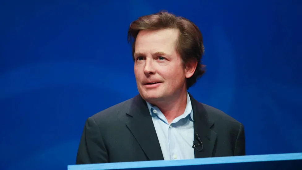 Michael J. Fox at podium giving speech