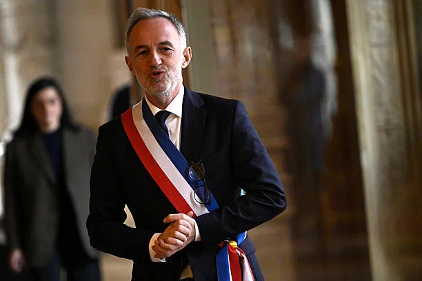 Paris' newly elected Mayor Emmanuel Grégoire, wearing his tricolour mayoral sash, arrives to speak to journalists after the inaugural city council...