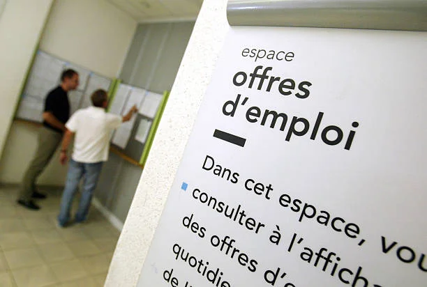 Job-seekers look at job classified ads in an Agence Nationale Pour l'Emploi unemployment agency in Paris, France, Friday, July 22, 2005. French...