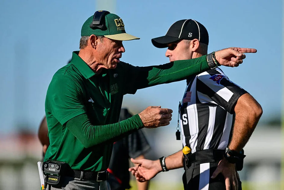 FORT COLLINS, COLORADO - OCTOBER 3: Head coach Jim Mora of the Colorado State Rams interacts with a referee during a game against the Oregon State Beavers at Canvas Stadium on October 3, 2026 in Fort Collins, Colorado.