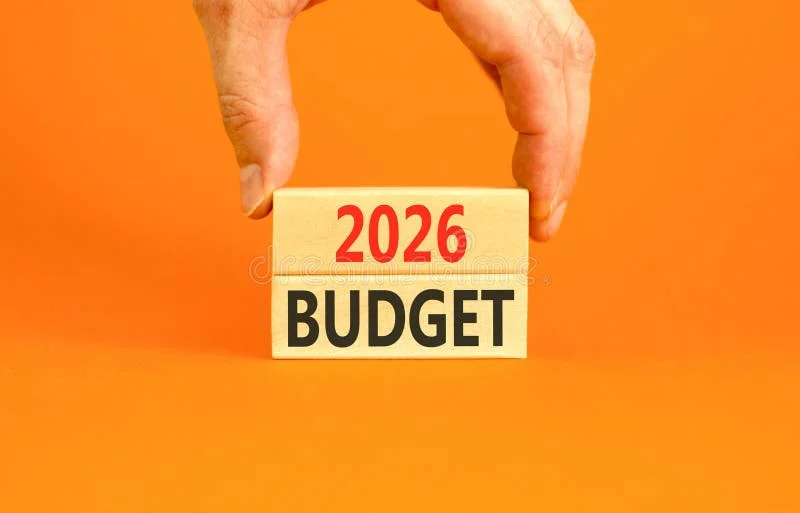 2026 Budget symbol. Concept words 2026 Budget on beautiful wooden blocks. Beautiful orange paper background. Businessman's hand. Business and 2026 budget concept. Copy space. 2026 budget stock images, royalty-free photos and pictures